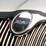 464 54 Emblema de cubierta Milotec - frontal, Škoda Superb I, Octavia II, Octavia II Facelift, Roomster, Fabia II, Yeti 